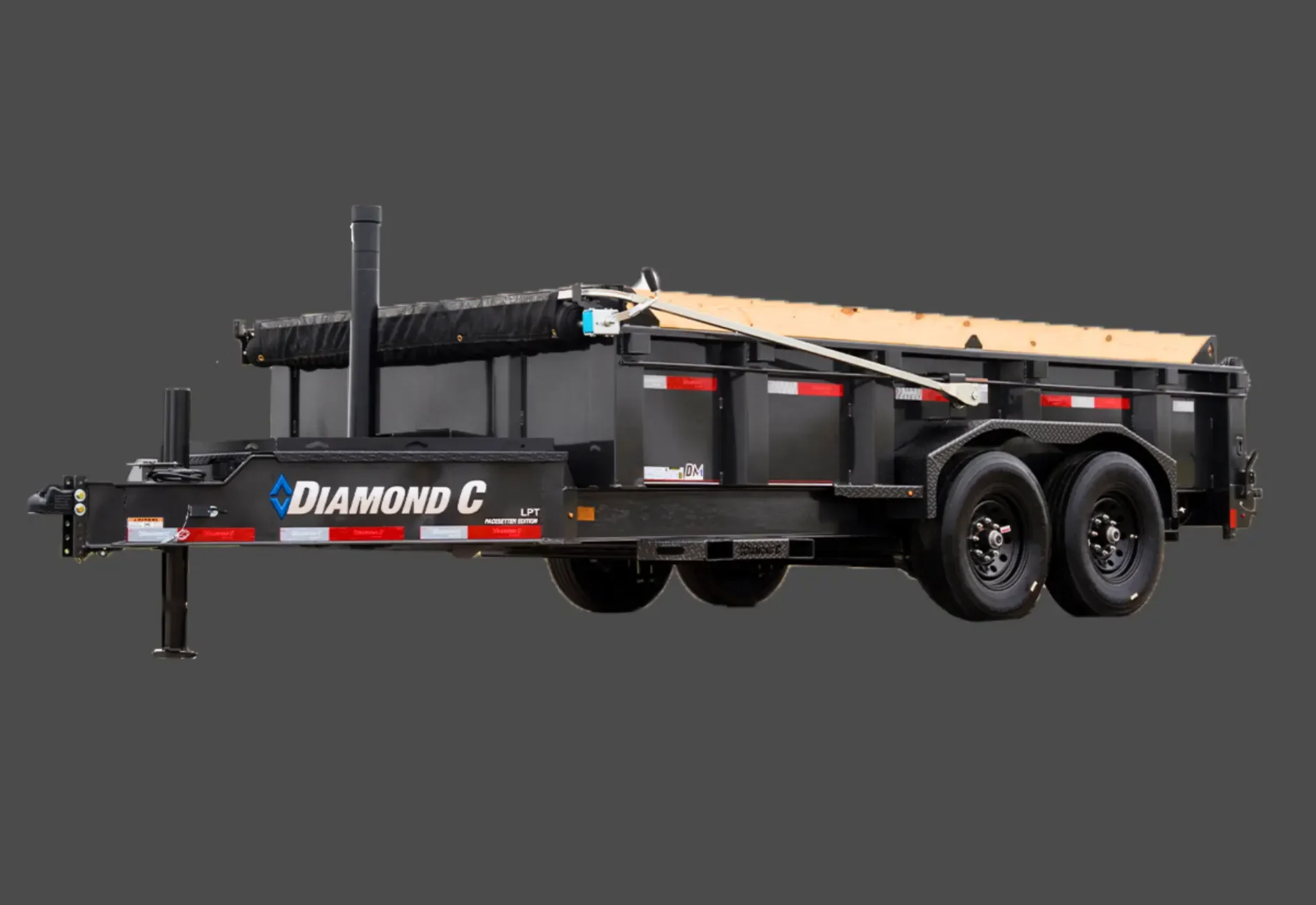 Black dump trailer with dual axles and side boards