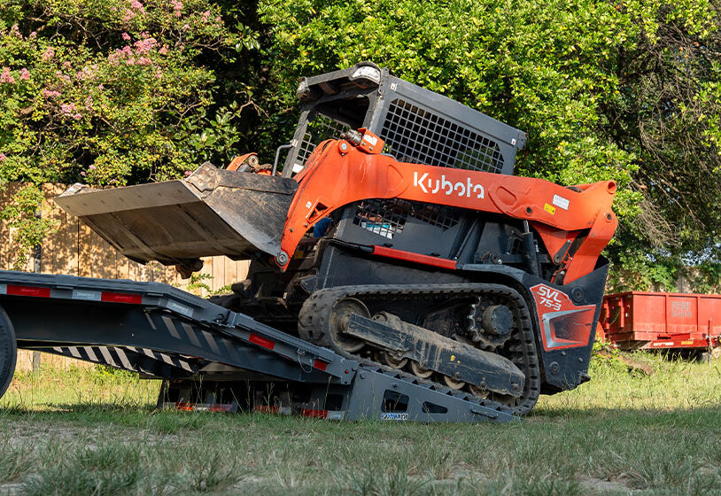 Iron Bull equipment trailer with skid steer loading for sale in Texas at Trailer Place