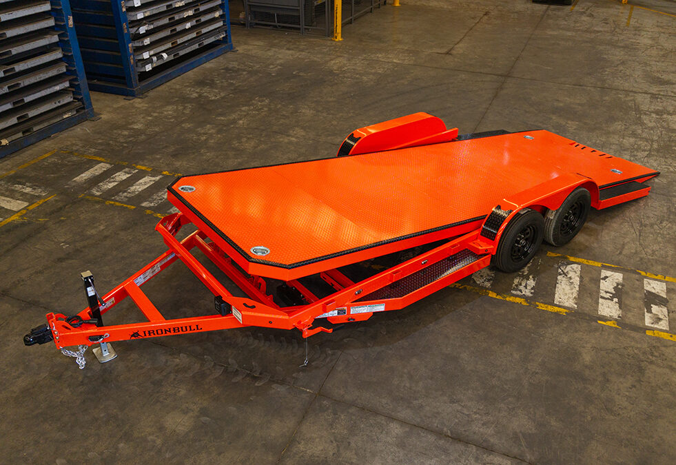 Iron Bull orange tilt equipment trailer for sale in Texas at Trailer Place