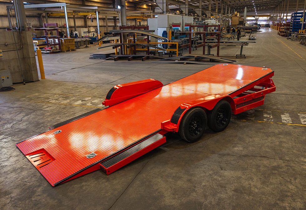 Iron Bull orange tilt trailer with ramp down for sale in Texas at Trailer Place
