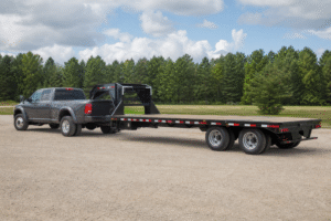 Read more about the article Pintle Hitch vs Gooseneck: Which Is Right for Hauling Heavy Equipment in Texas?