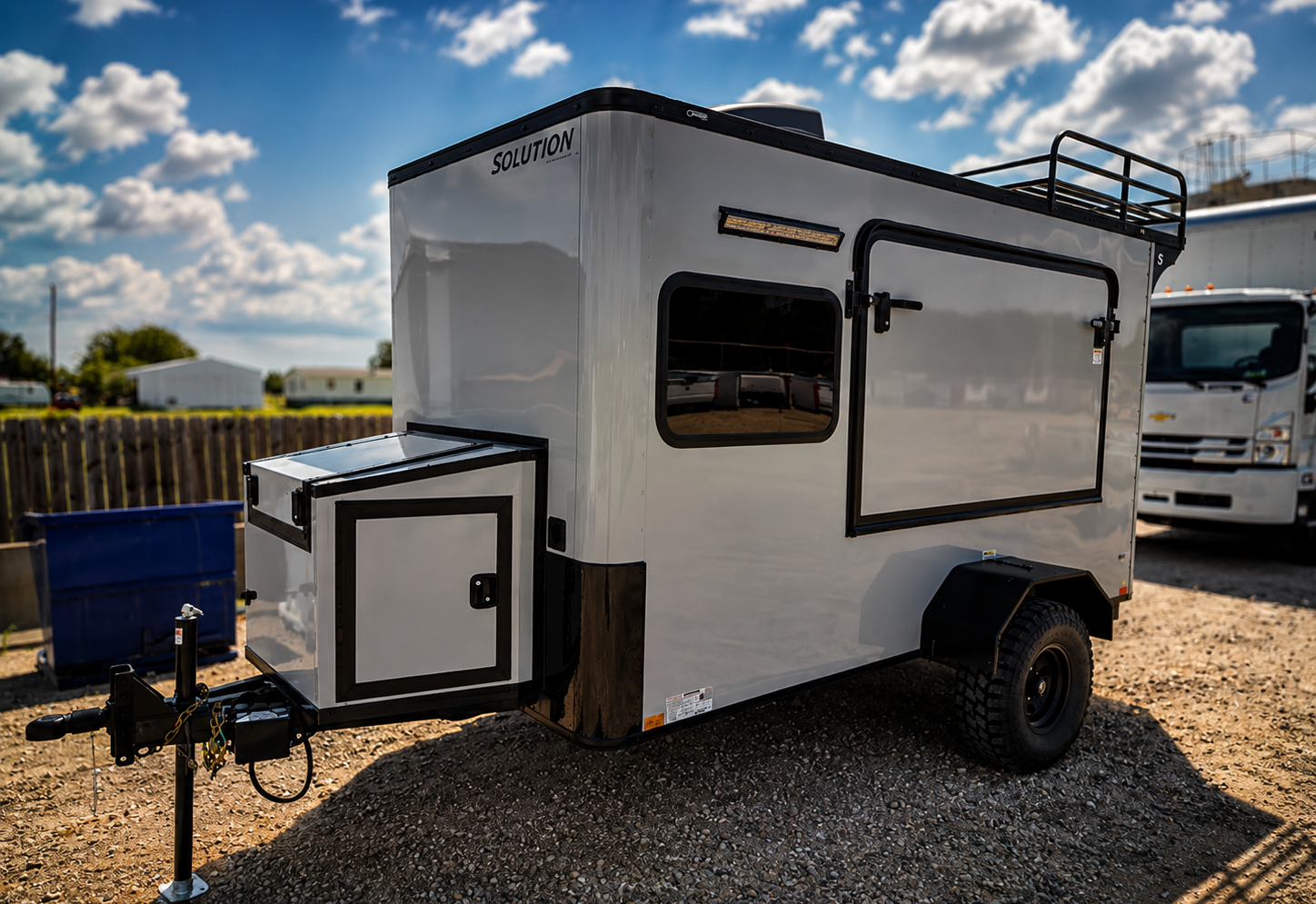 offroadtrailers.solutiontrailers.trailerplace.camping.travel.rosenberg.trailerdealer.number1trailerdealer.texas.houston.sugarland.dallas.sanantonio.besttrailerdeals Solution off-road camping trailer with roof rack and all-terrain tires at Trailer Place, Rosenberg TX